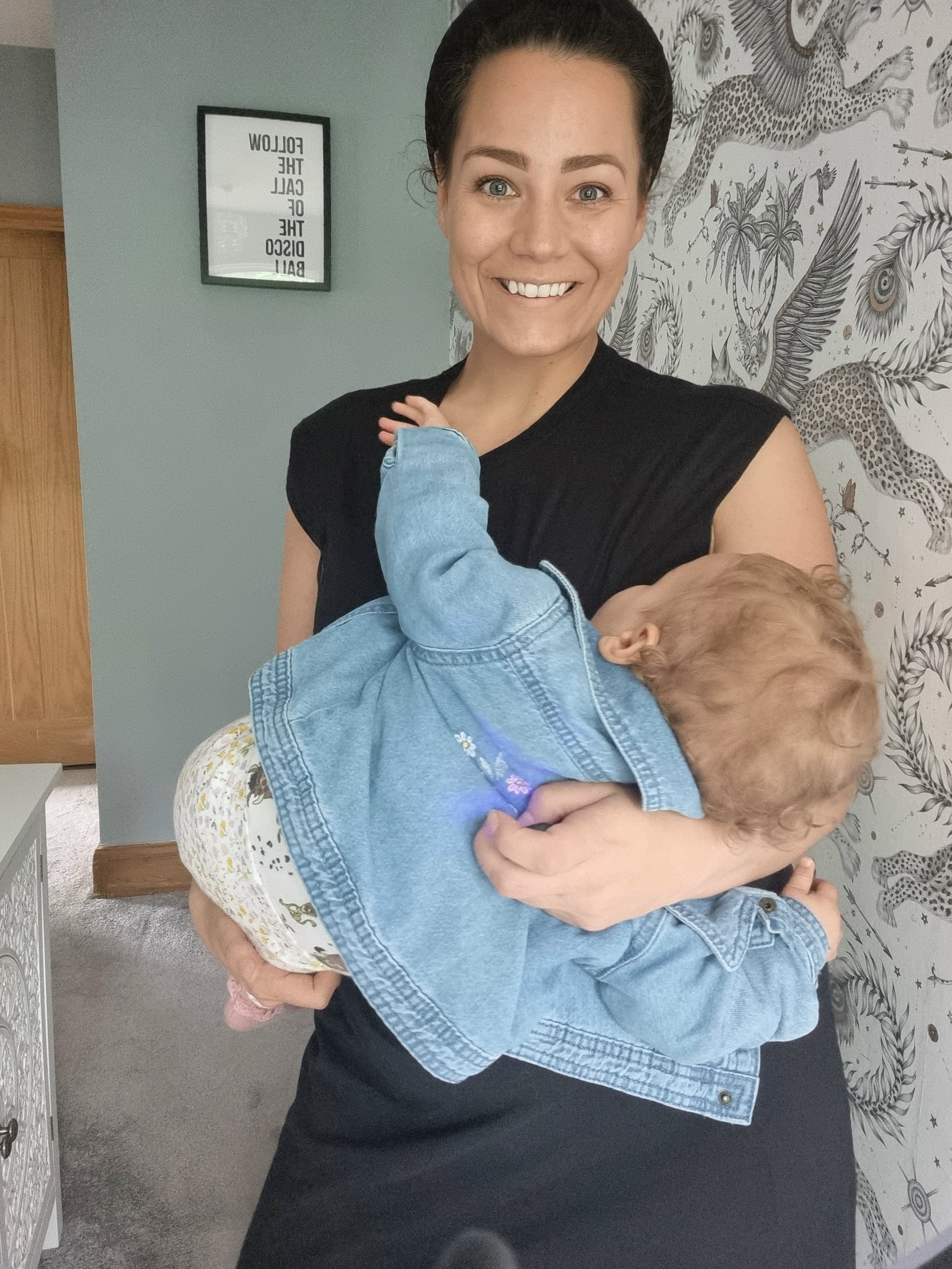 Mum breastfeeding baby in nursing dress