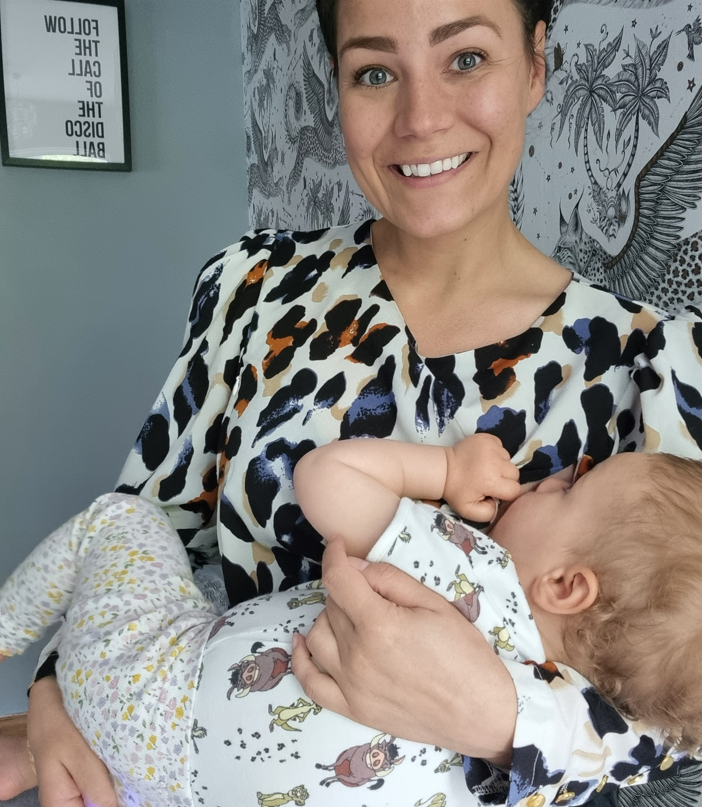 Mum breastfeeding baby in nursing top